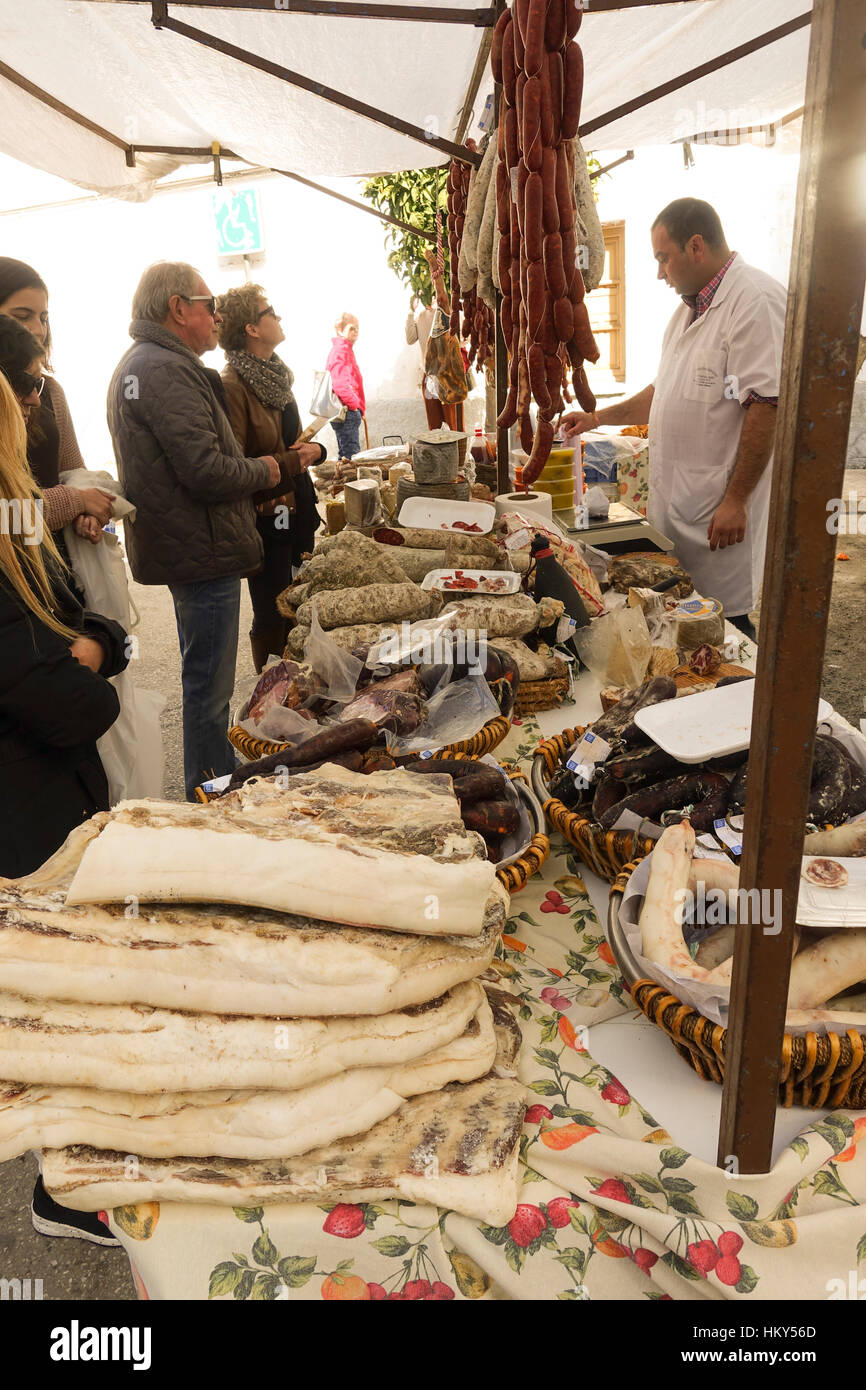 Assortment of spanish sausages and lard meat on display at Spanish