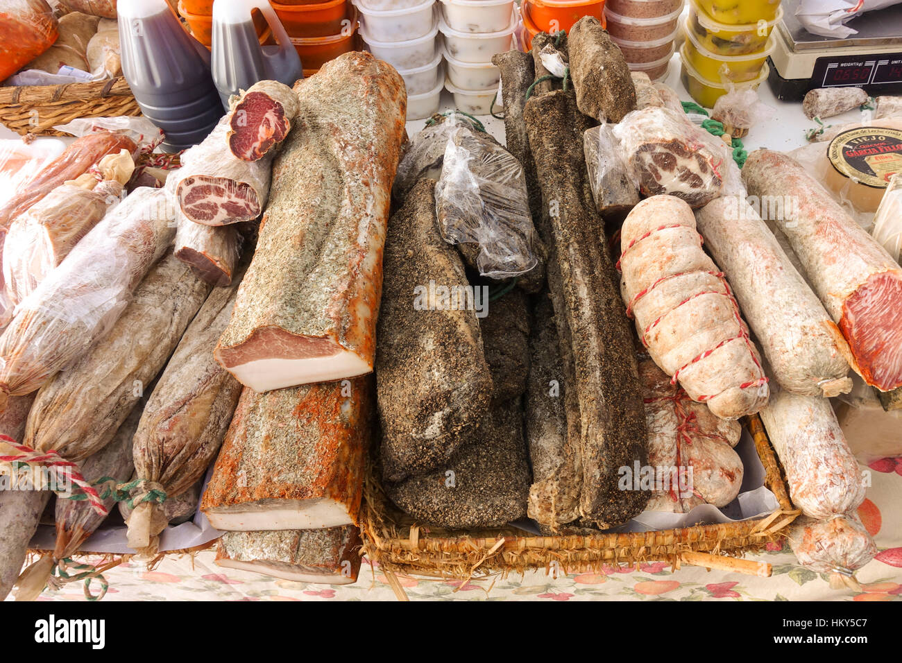 Assortment of spanish sausages and meat on display at Spanish market, Southern Spain. Guard