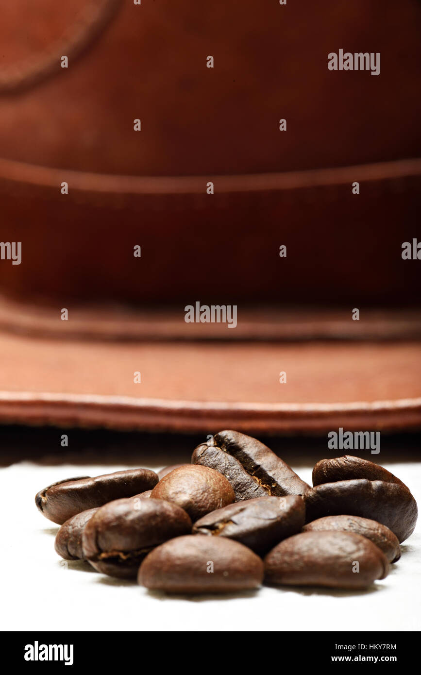 close up of coffee beans on leather farmer hat background Stock Photo
