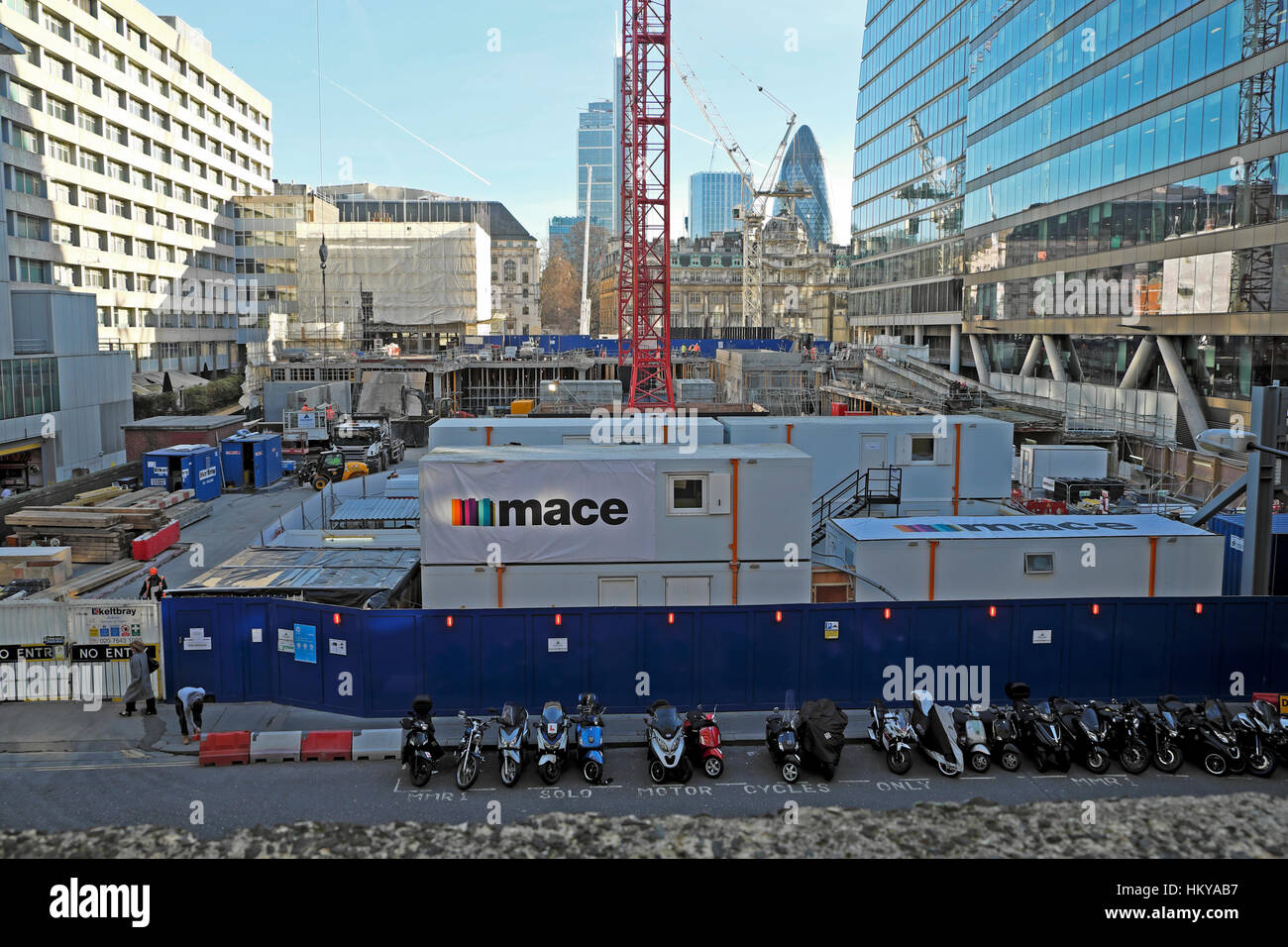 Construction site with view of gherkin building MACE sign adjacent to