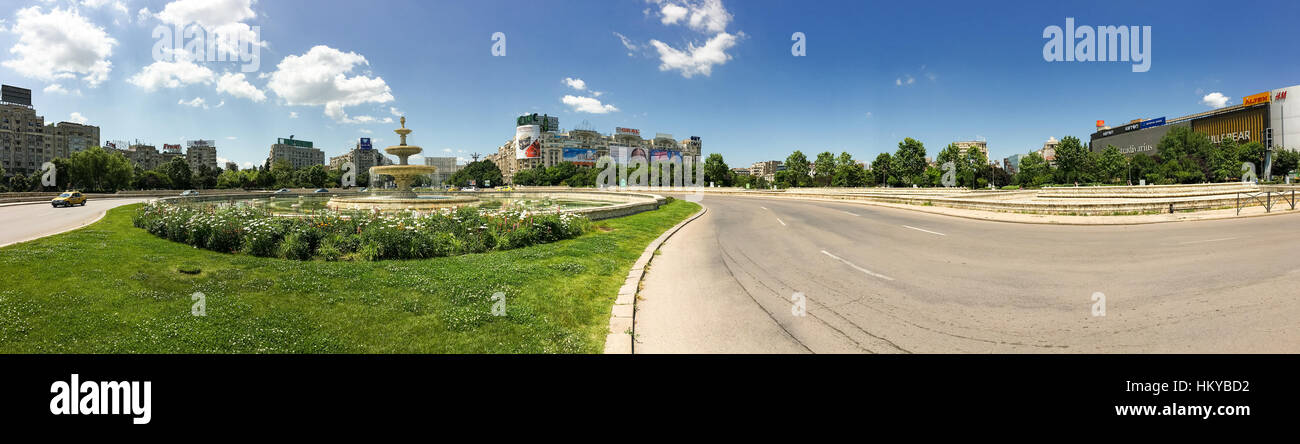 BUCHAREST, ROMANIA - MAY 28, 2016: Union Square Fountain And House Of The People Or Parliament Palace (Casa Poporului) View From Union Boulevard (Bule Stock Photo