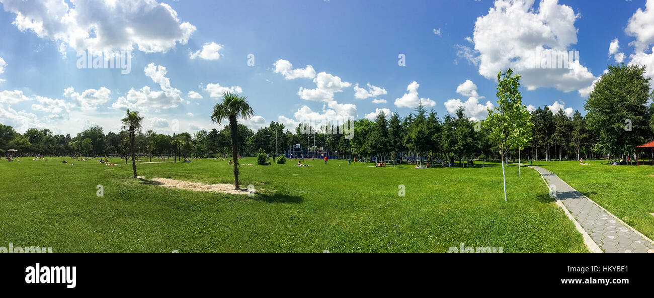 BUCHAREST, ROMANIA - JUNE 05, 2016: People Enjoying Hot Summer Weather And Getting Tanned In Tineretului Park Of Bucharest City. Stock Photo