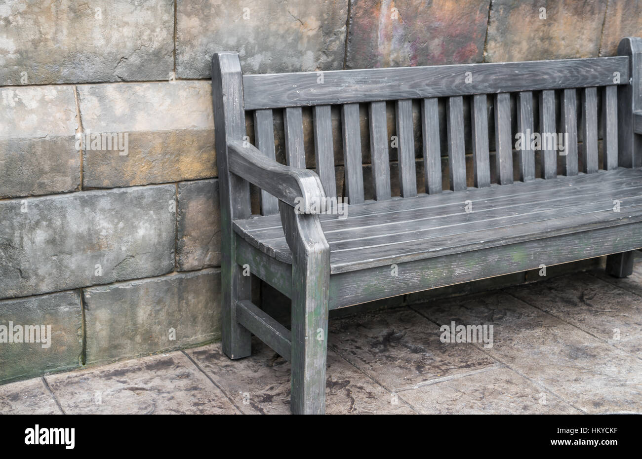 Wood Bench against concrete wall Stock Photo - Alamy