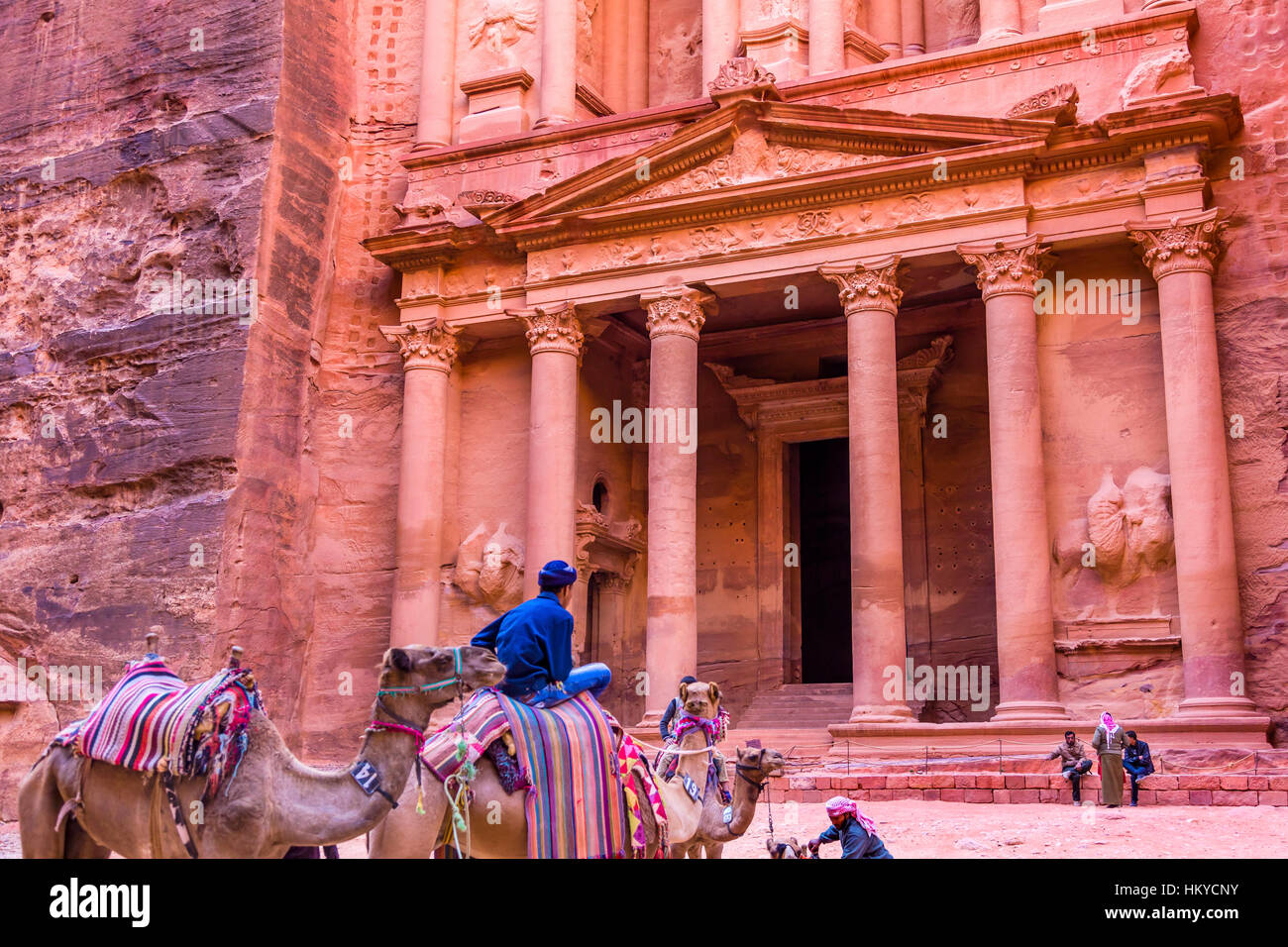 GRose Red Treasury in Afternoon Becomes Golden in Morning Camels Siq Petra Jordan Petra Jordan. Treasury built by the Nabataens in 100 BC. Stock Photo