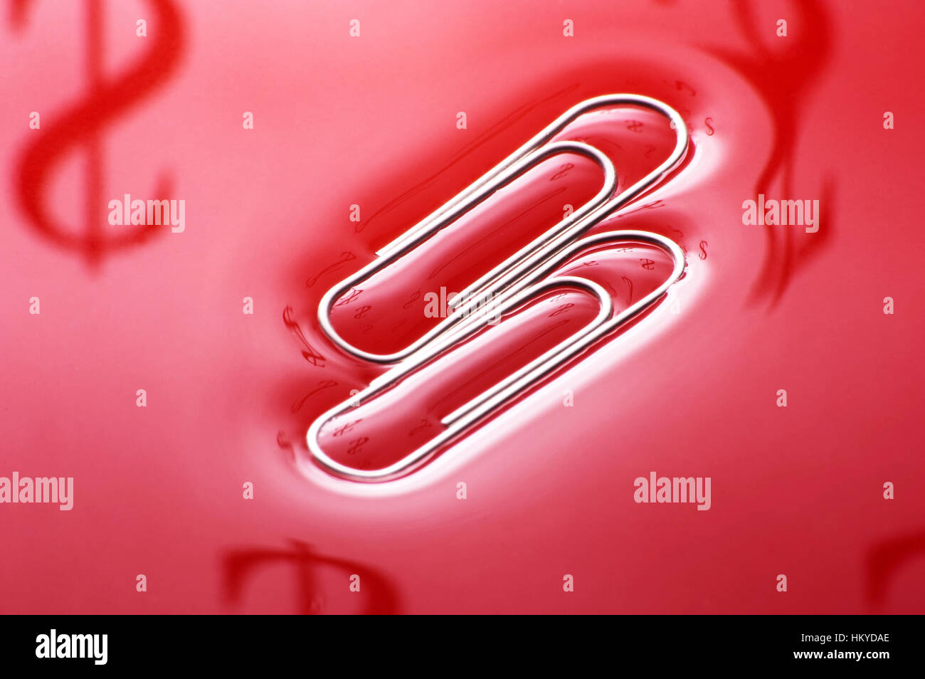 two paper clips on red background with dollar symbol Stock Photo Alamy