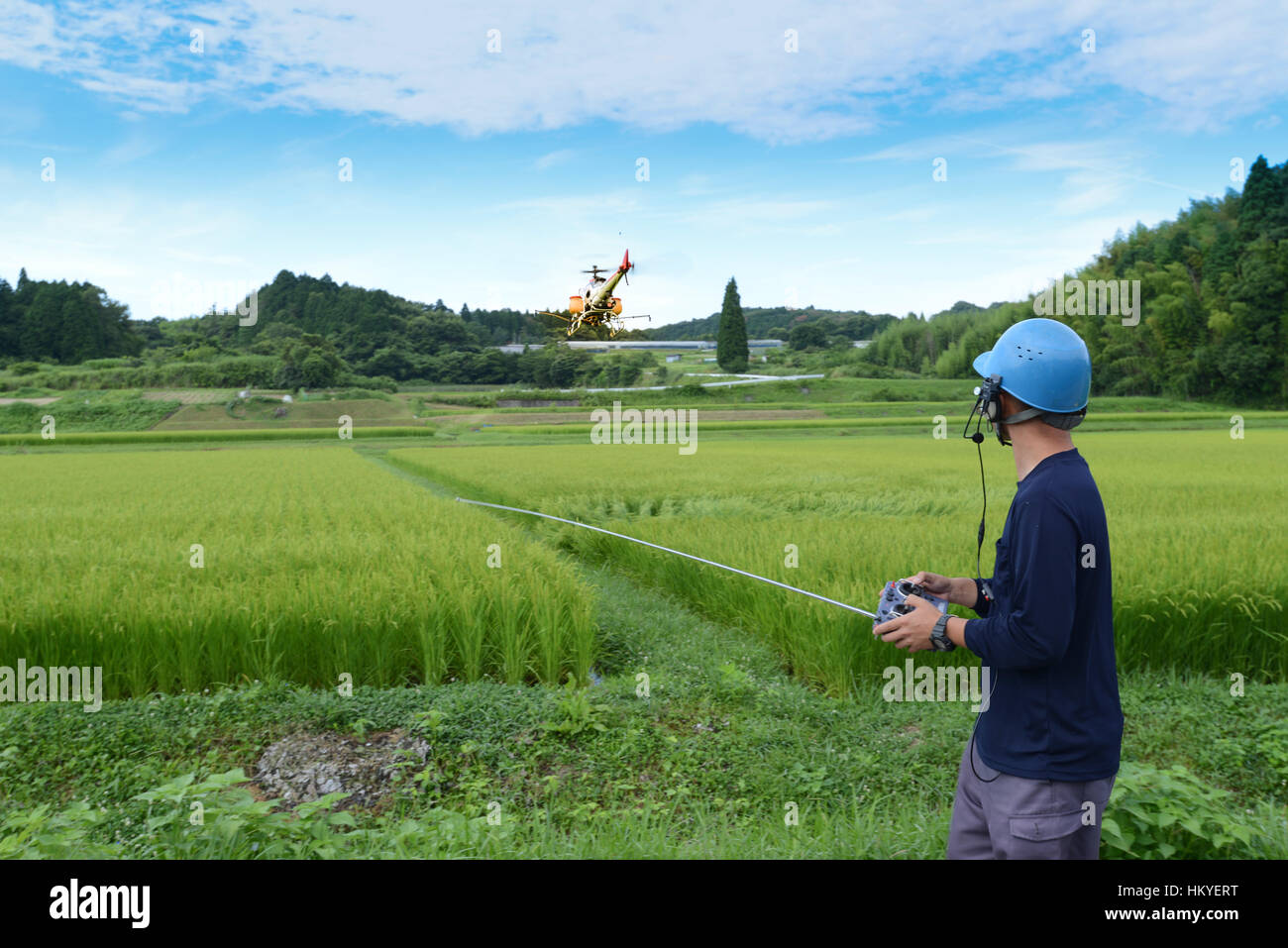 remotelypiloted helicoptertype drone designed to spray crops Stock