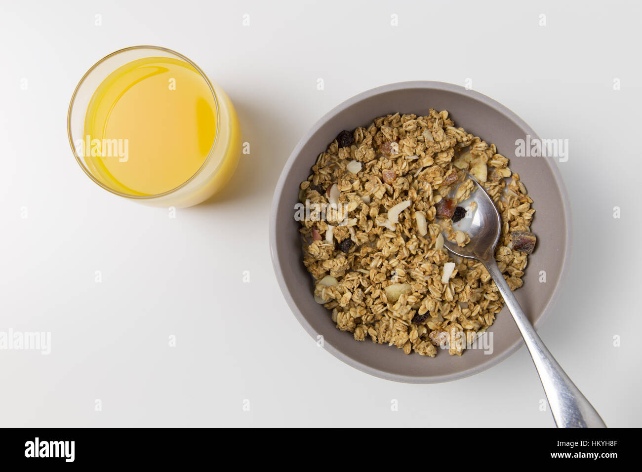 Cereal and orange juice breakfast setting Stock Photo Alamy