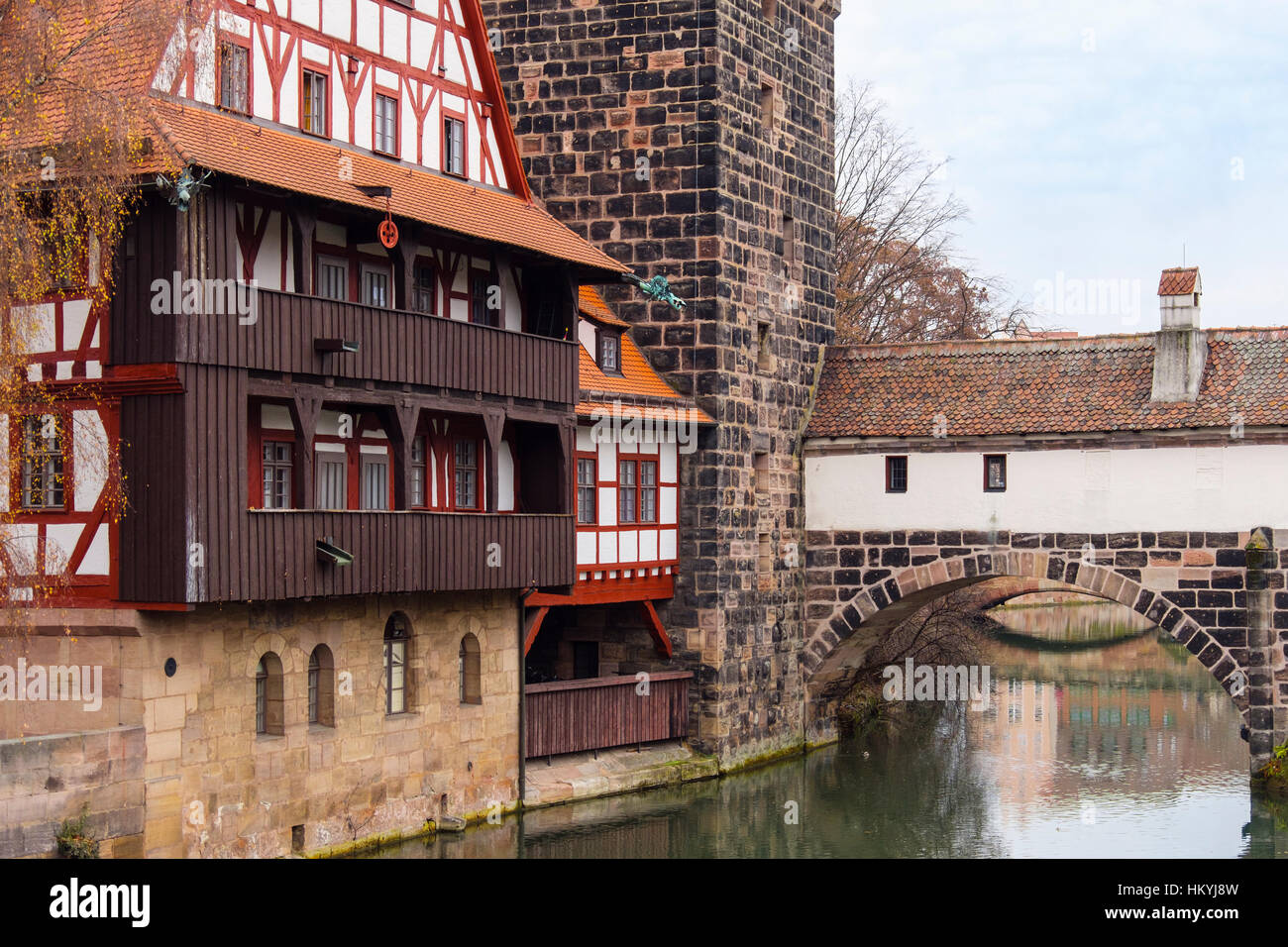15th century Weinstadle timbered building and Henkersteg or Hangman's Bridge over Pegnitz River.  Nuremberg, Bavaria, Germany, Europe Stock Photo