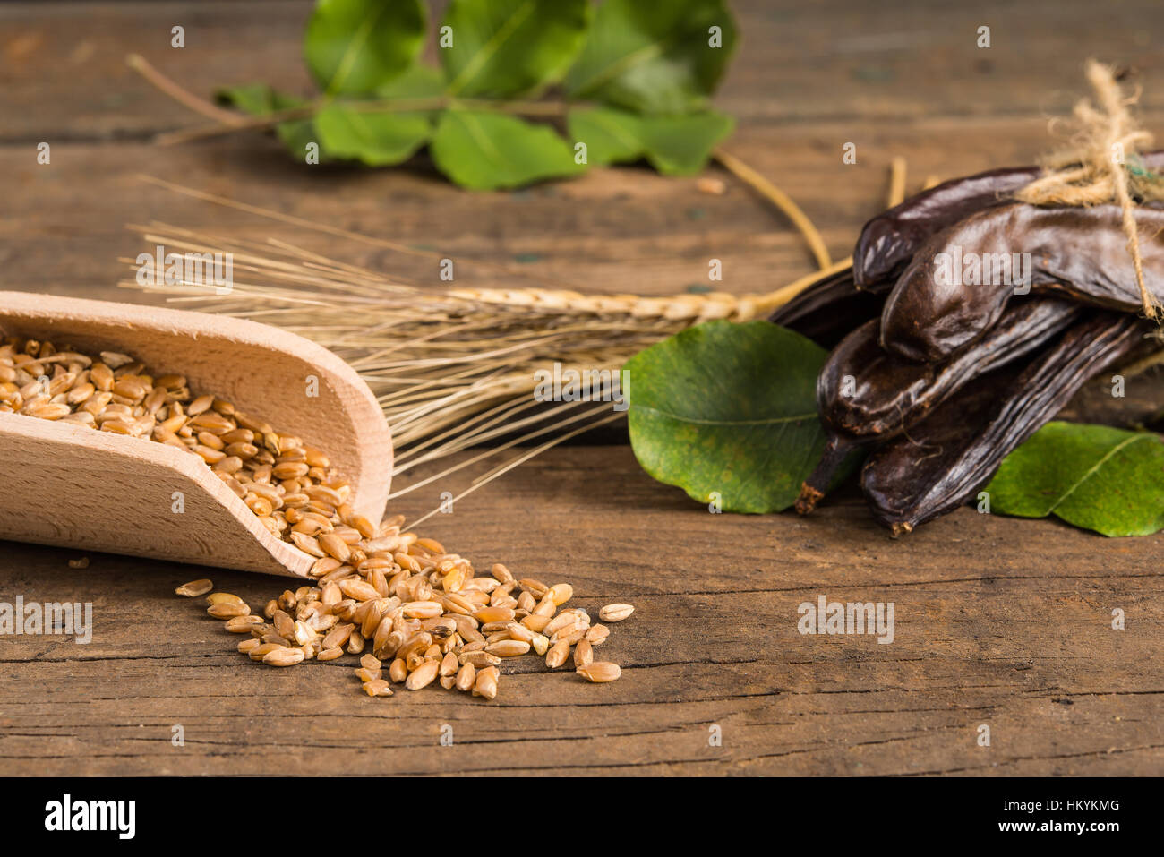 Raw fruits Carob on old wooden background Stock Photo