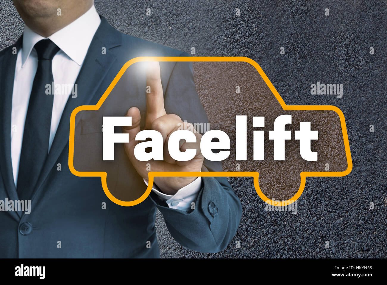 Facelift auto touchscreen is operated by man. Stock Photo