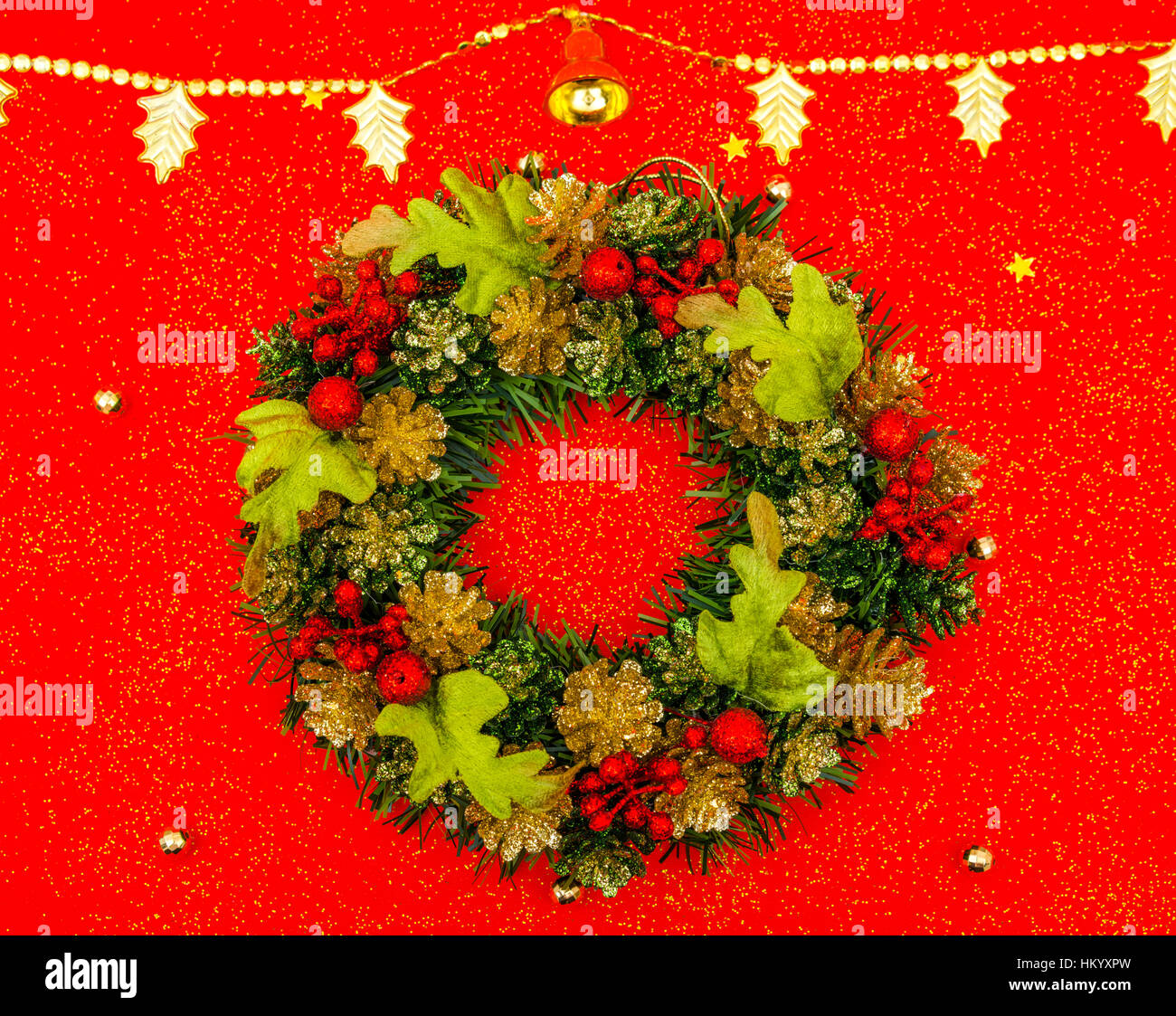 Christmas wreath on red background Stock Photo - Alamy