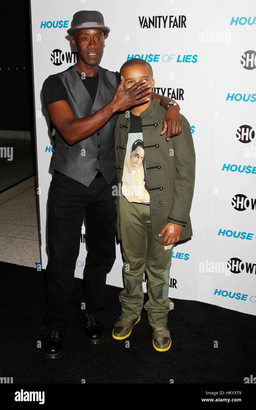 Don Cheadle, left, and  Donis Leonard Jr. arrive at the Showtime Premiere Party and Screening of House of Lies in Los Angeles, California, on January 4, 2012. Photo by Francis Specker Stock Photo