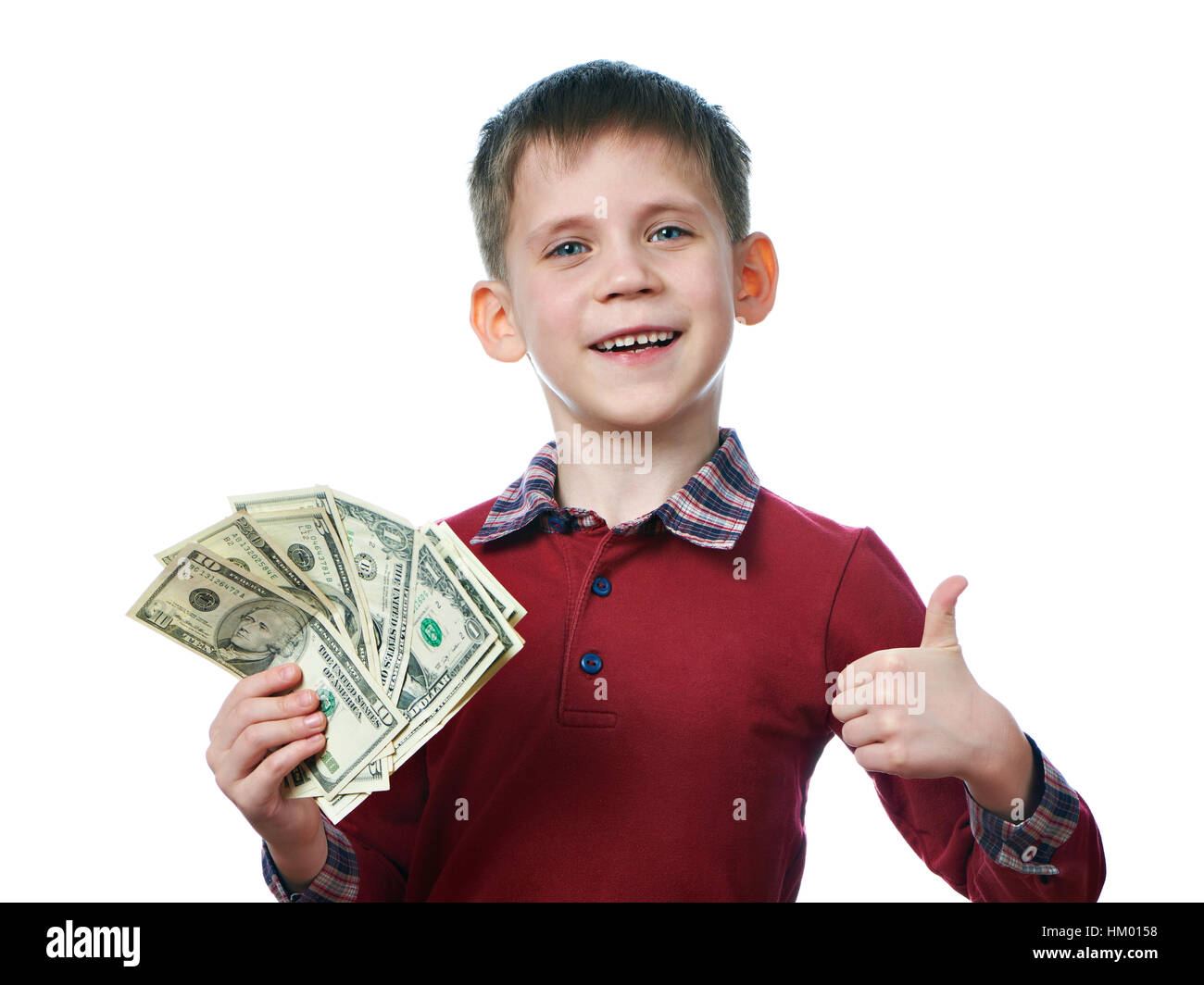 Happy little boy with dollar bills in his hands isolated white Stock