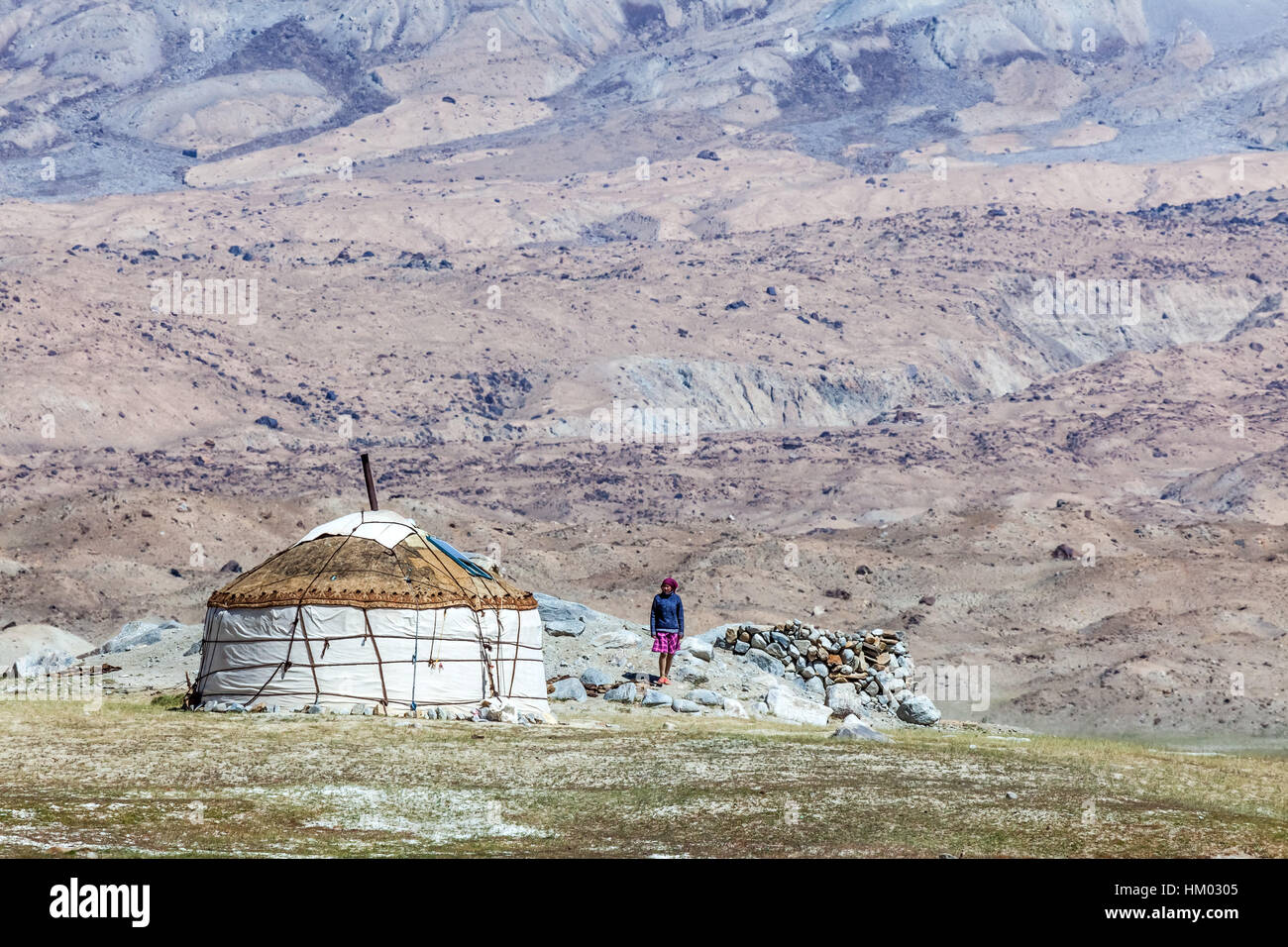 Kyrgyz yurt in the landscape around Karakul Lake (lake is 3,600 meters above sea level, at the foot of the Maztagata Mountain), Xinjang, China. Stock Photo