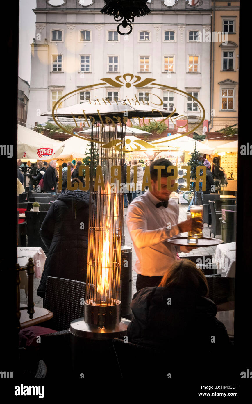 Serving beer at cafe noworolski cloth hall main market square krakow poland Cracow christmas Stock Photo