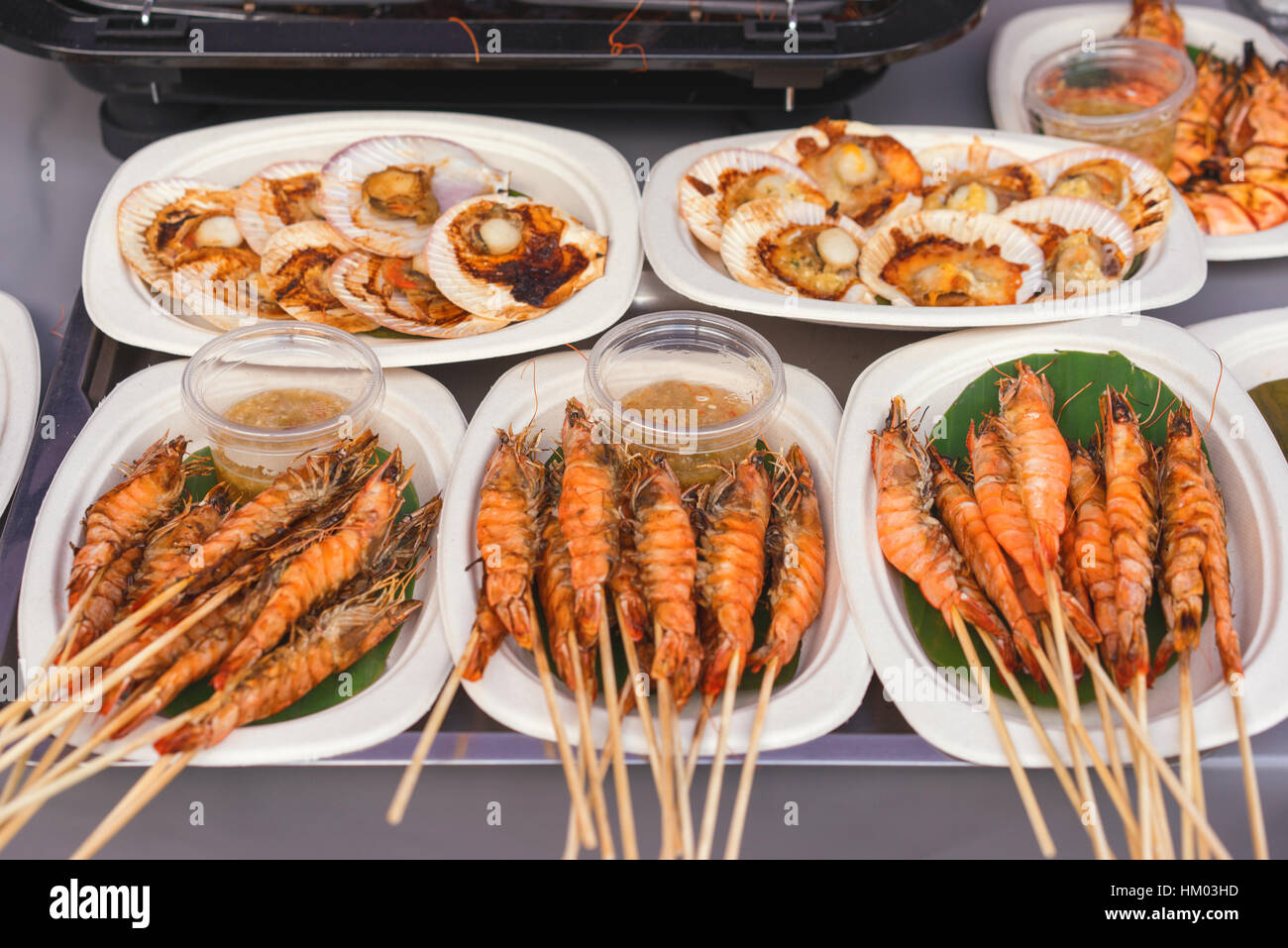 bbq king prawns and scallops at a buffet table, seafood barbecue for banquet party Stock Photo