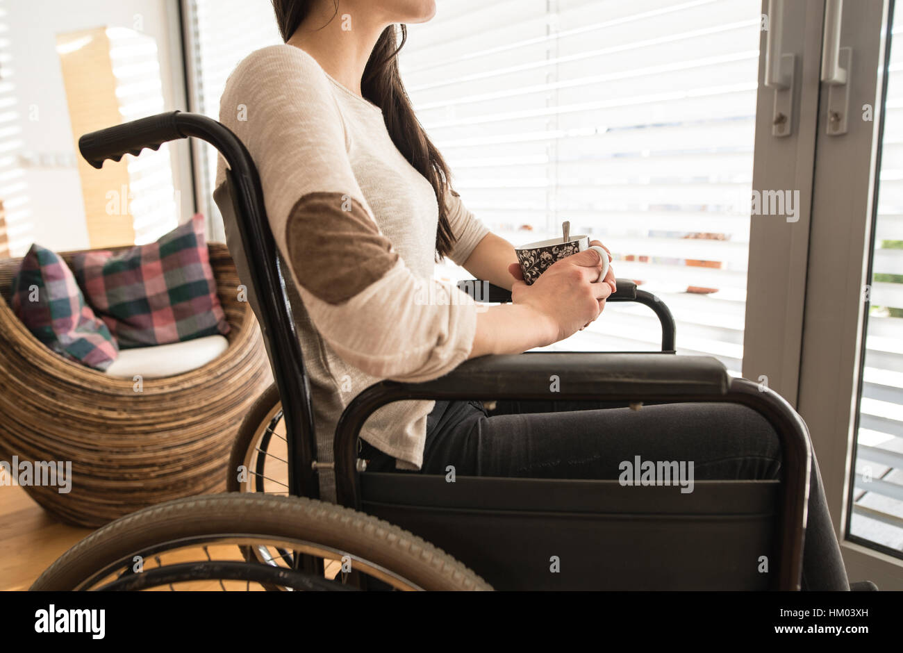 Disabled young woman in wheelchair hi-res stock photography and images ...
