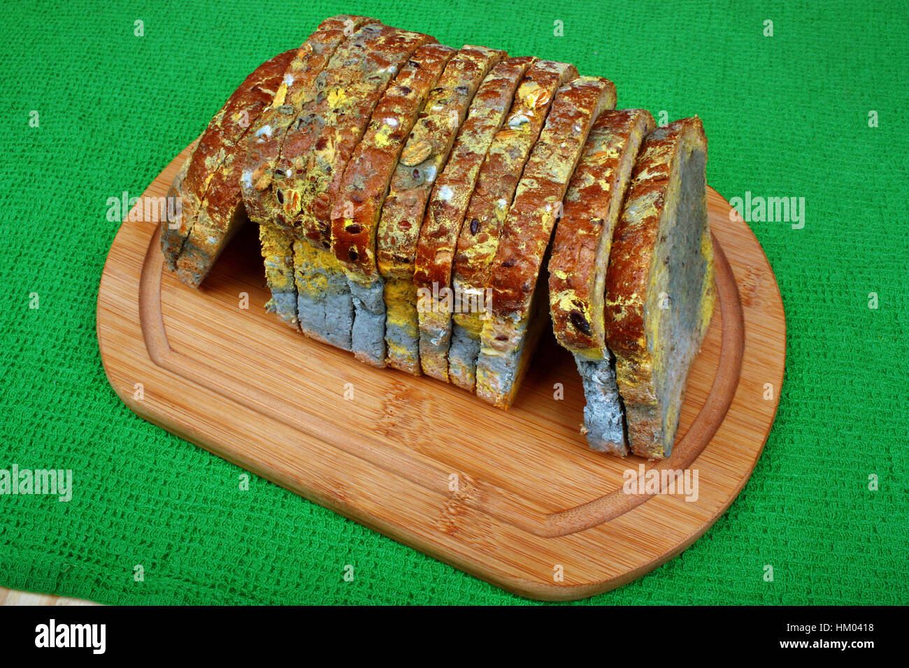 The old black mold on the bread, spoiled and mold food Stock Photo
