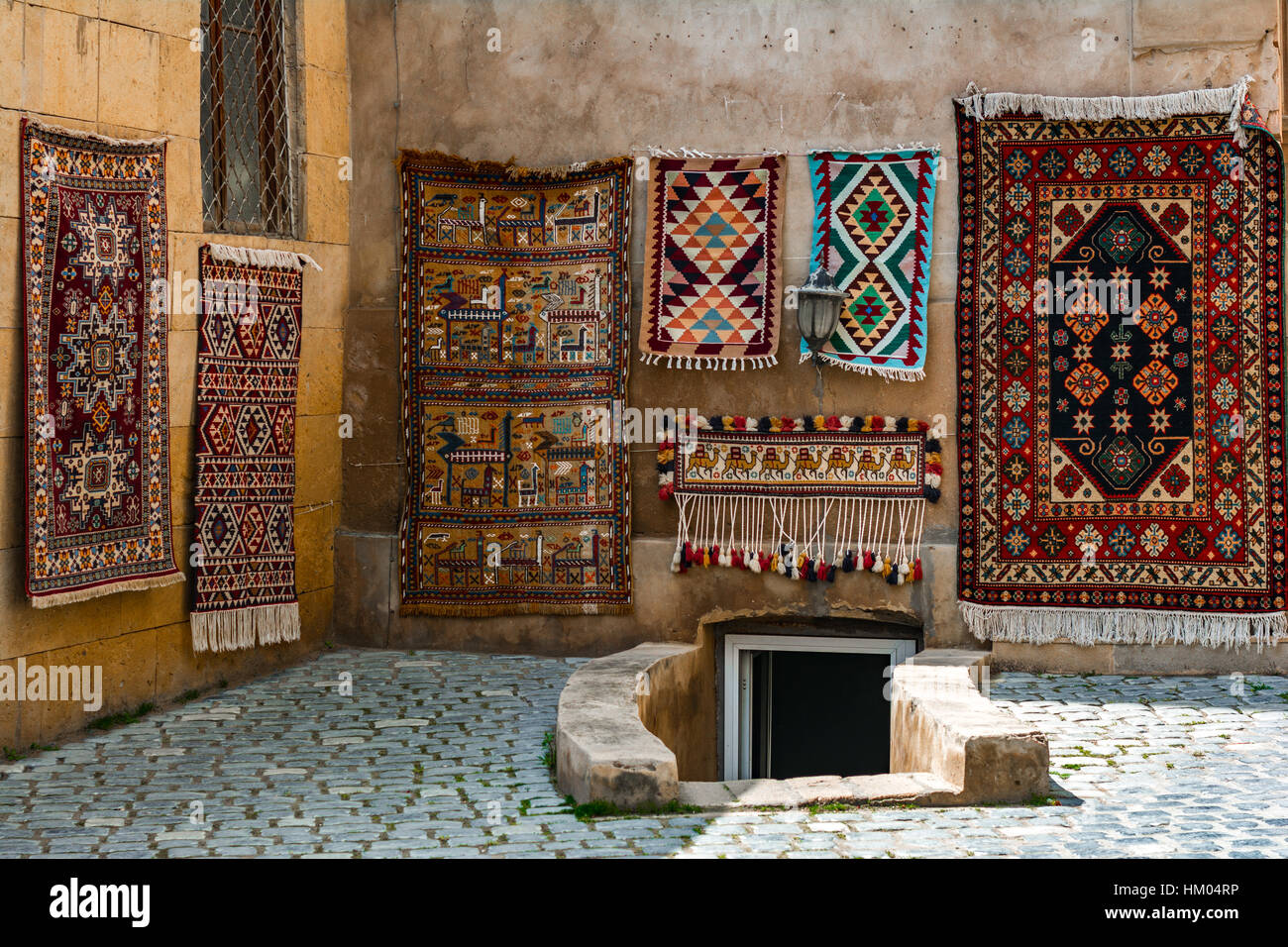 Sale of old carpet in eastern city Stock Photo Alamy