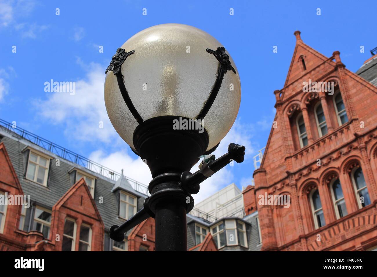 Lamp post in the courtyard of Waterhouse Square, London, on a bright sunny day. July 2016 Stock Photo