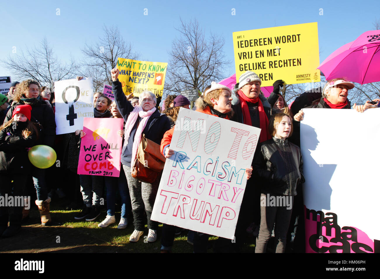 People take part in rally held in solidarity with the upcoming Women's ...
