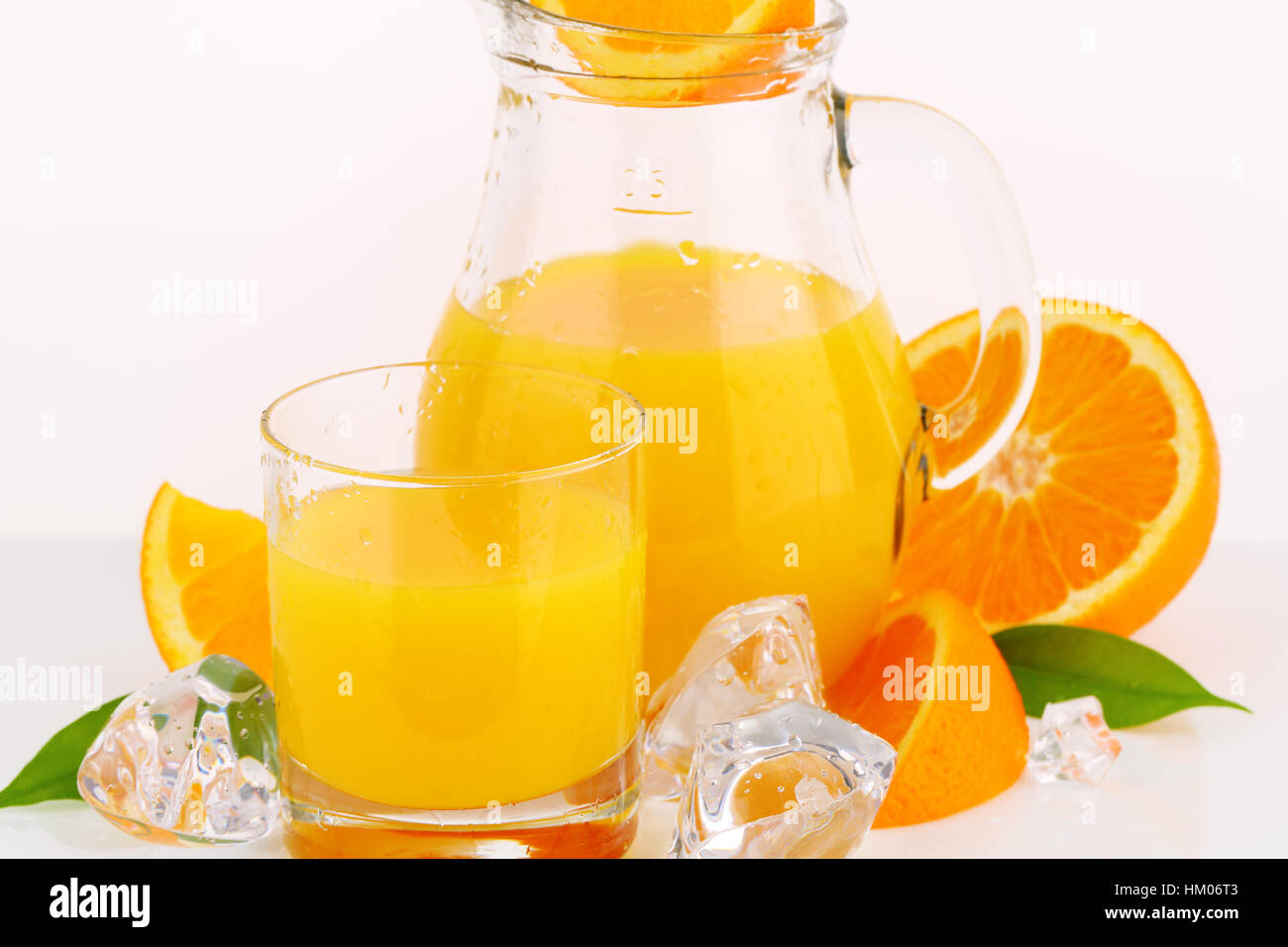 pitcher and a glass of orange juice Stock Photo - Alamy