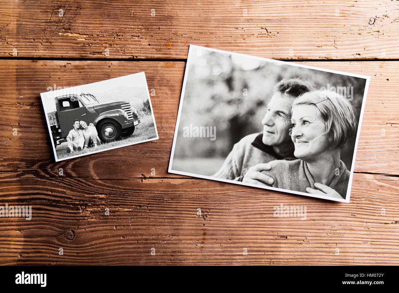 Black-and-white pictures of senior couple. Studio shot on wooden Stock Photo