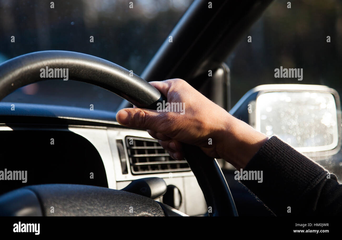 male hands on wheel driving a car Stock Photo Alamy