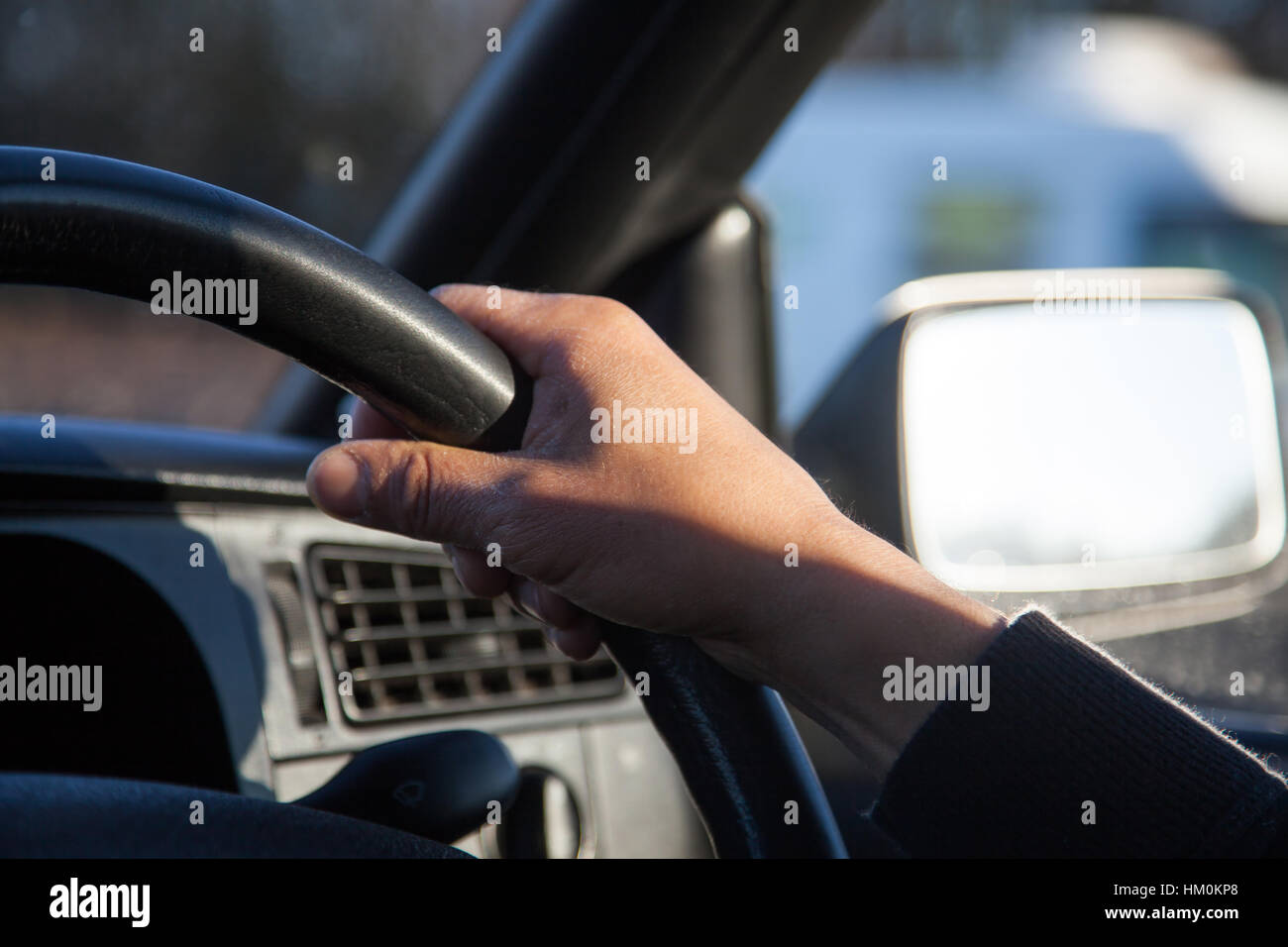 male hands on wheel driving a car Stock Photo Alamy