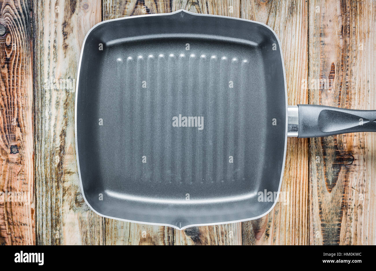 Grill pan on wood Stock Photo Alamy