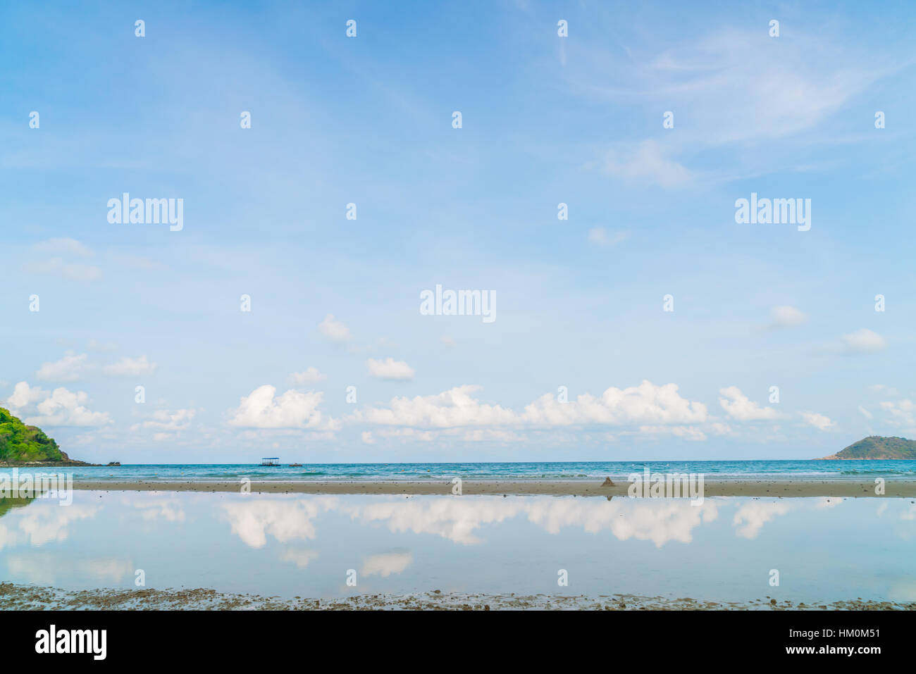 Beautiful white sand beach with blue sea and sky Stock Photo - Alamy