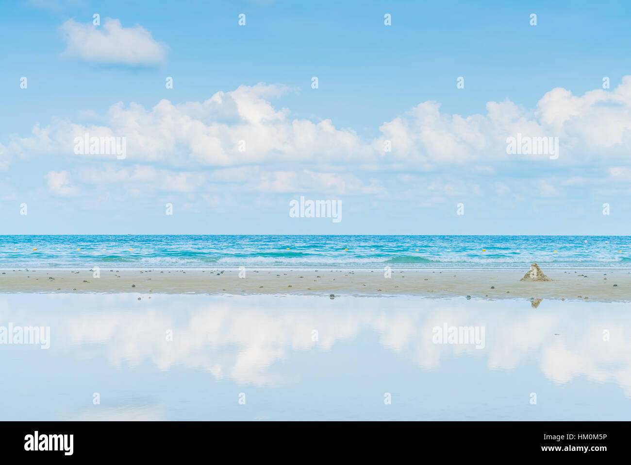 Beautiful white sand beach with blue sea and sky Stock Photo - Alamy