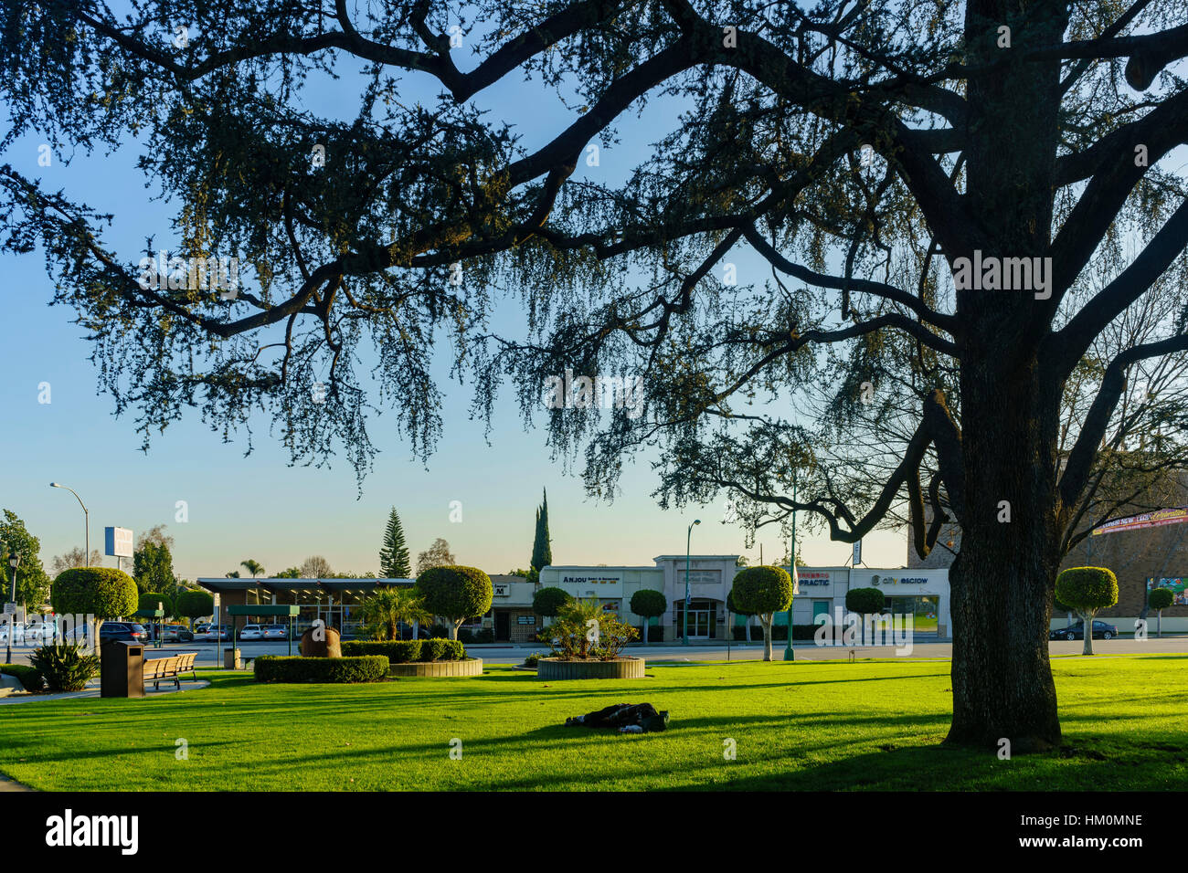 Beautiful Temple City Park with people sleeping at the field in Temple