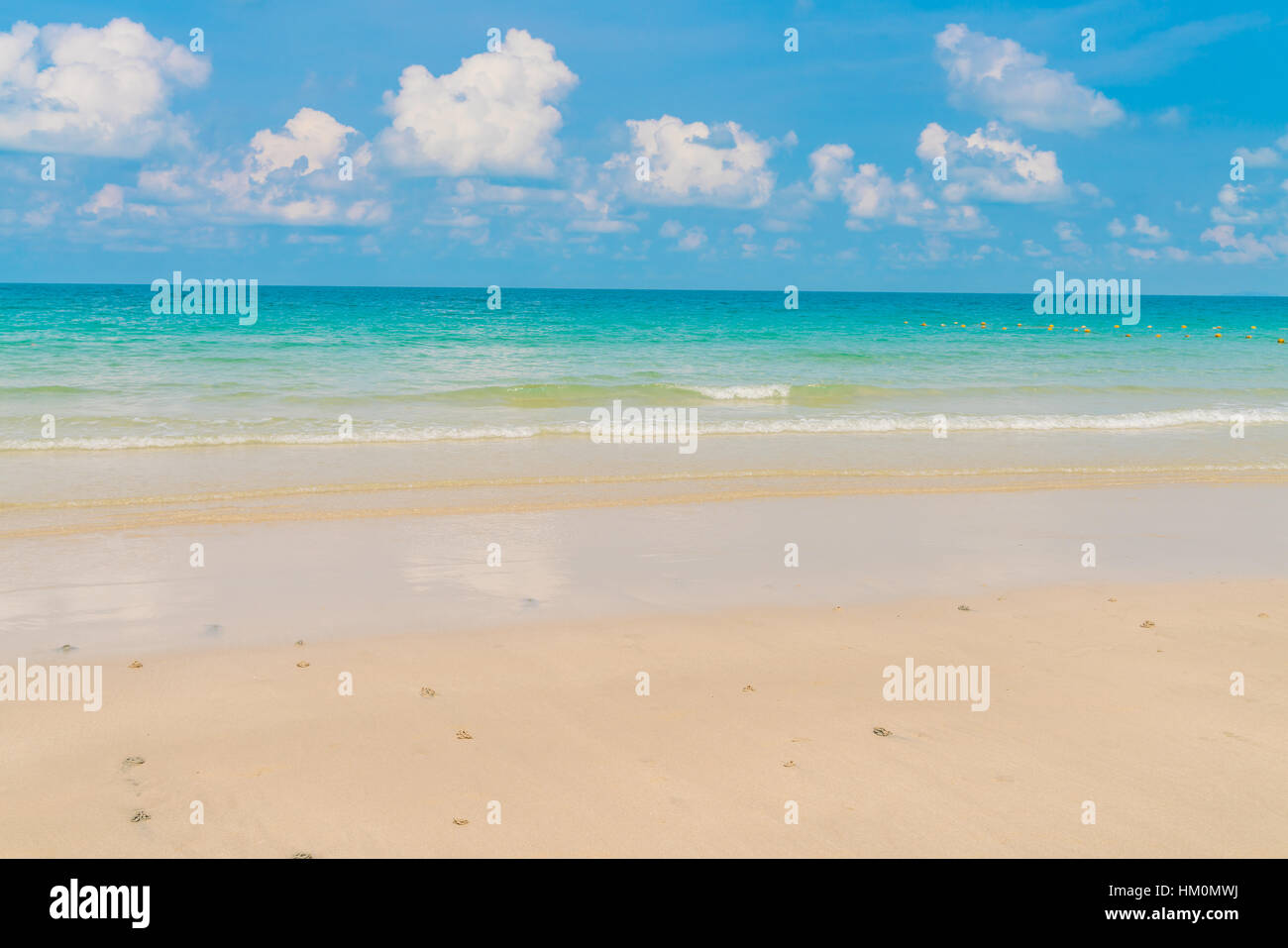 Beautiful white sand beach with blue sea and sky Stock Photo - Alamy
