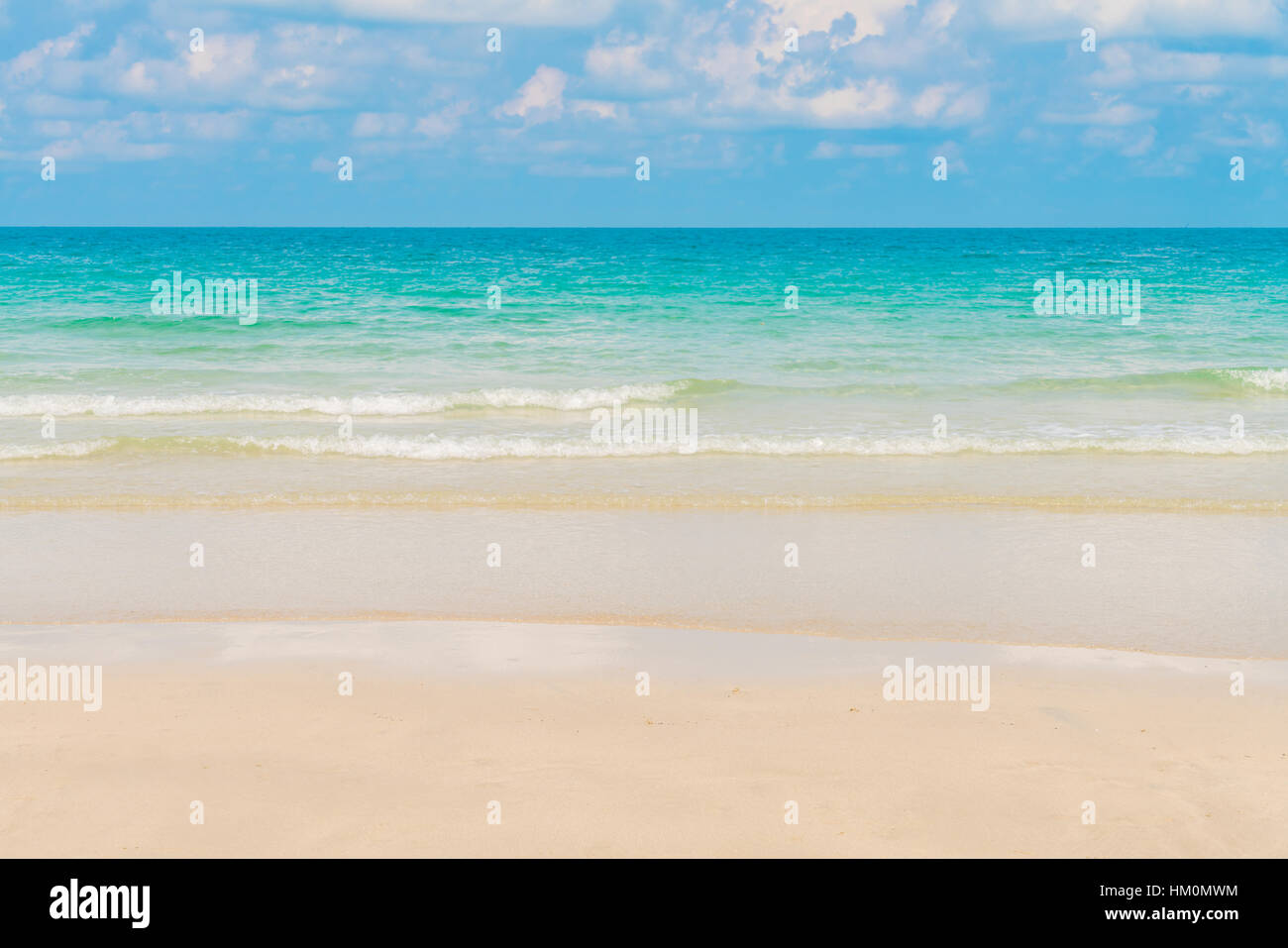 Beautiful white sand beach with blue sea and sky Stock Photo - Alamy