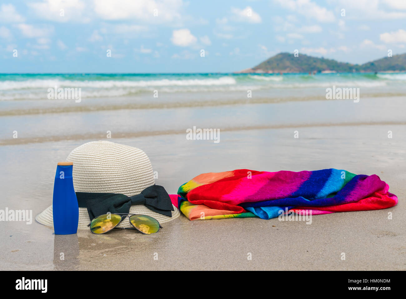 Sunglasses, sun cream and hat on white sand beach Stock Photo Alamy