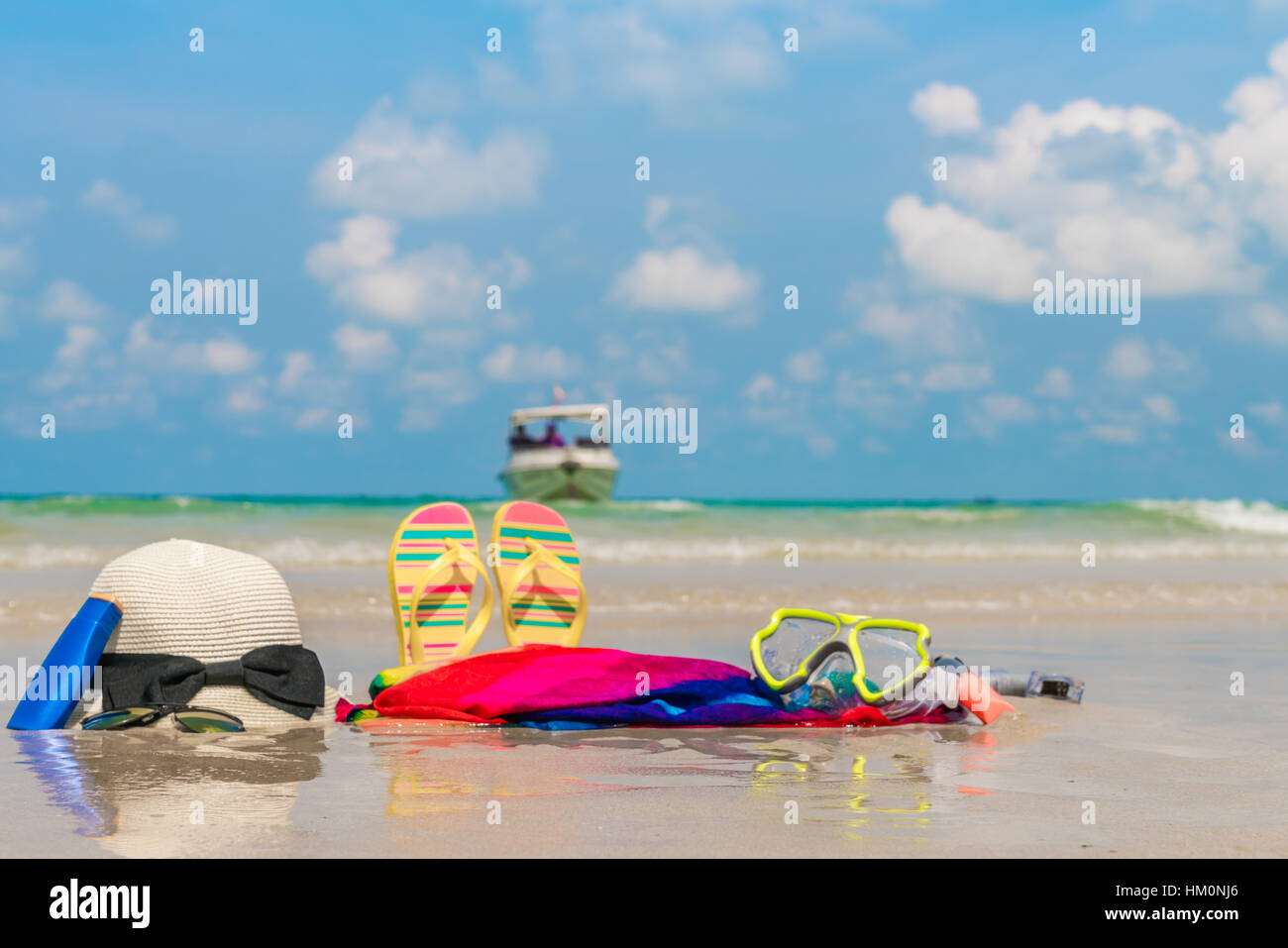 Sunglasses, sun cream and hat on white sand beach Stock Photo Alamy