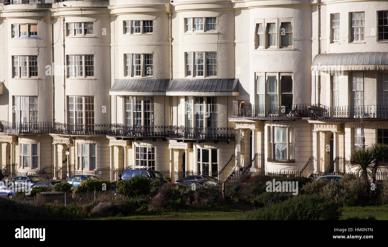 row of beautiful regency terraced houses on brighton seafront in west