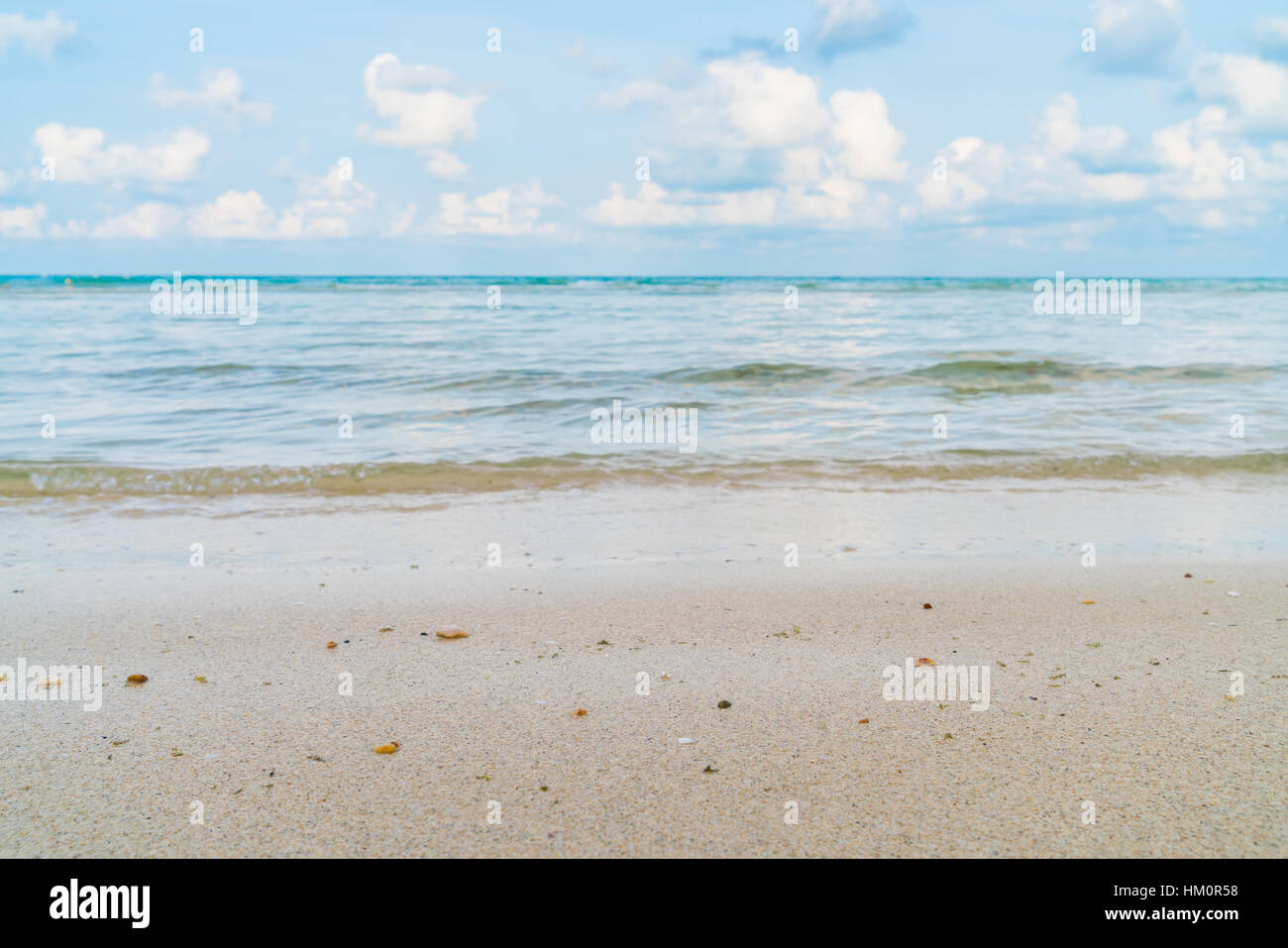 Beautiful white sand beach with blue sea and sky Stock Photo - Alamy