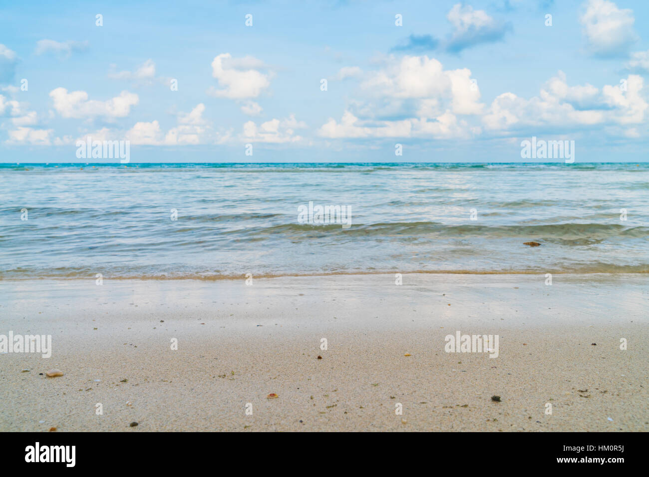 Beautiful white sand beach with blue sea and sky Stock Photo - Alamy