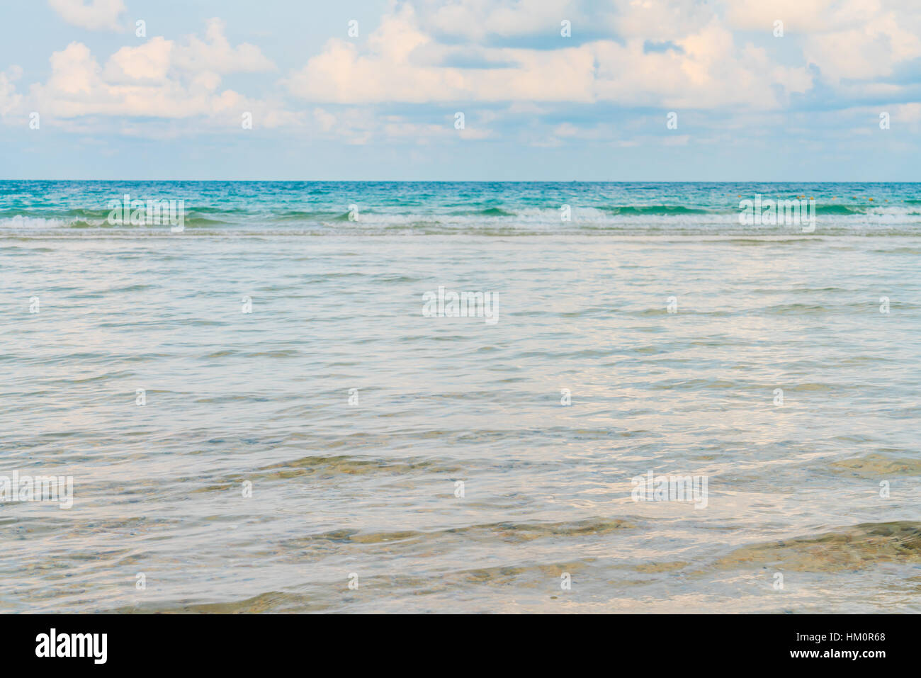 Beautiful white sand beach with blue sea and sky Stock Photo - Alamy