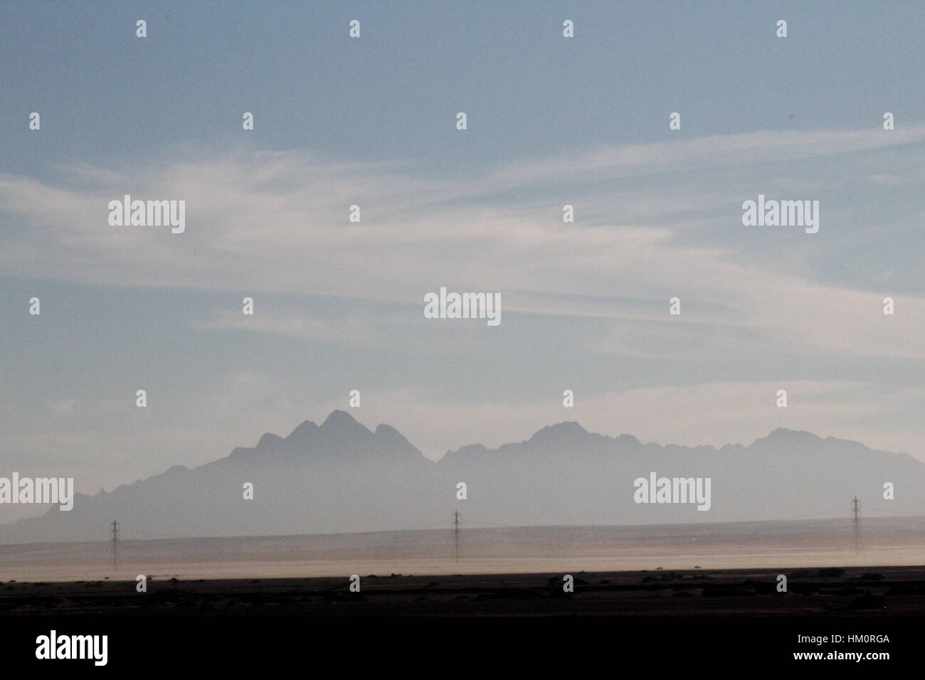 Desert with misty mountains in a B.G .On the way from Cairo to Hurghada, Egypt. Stock Photo