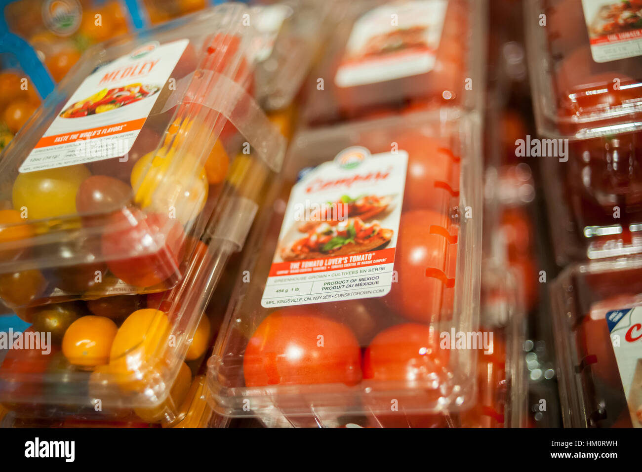 Mexican grown hot house tomatoes in the new Whole Foods Market opposite Bryant Park in New York on opening day Saturday, January 28, 2017. The store in Midtown Manhattan is the chain's 11th store to open in the city. The store has a large selection of prepared foods from a diverse group of vendors inside the store.  (© Richard B. Levine) Stock Photo