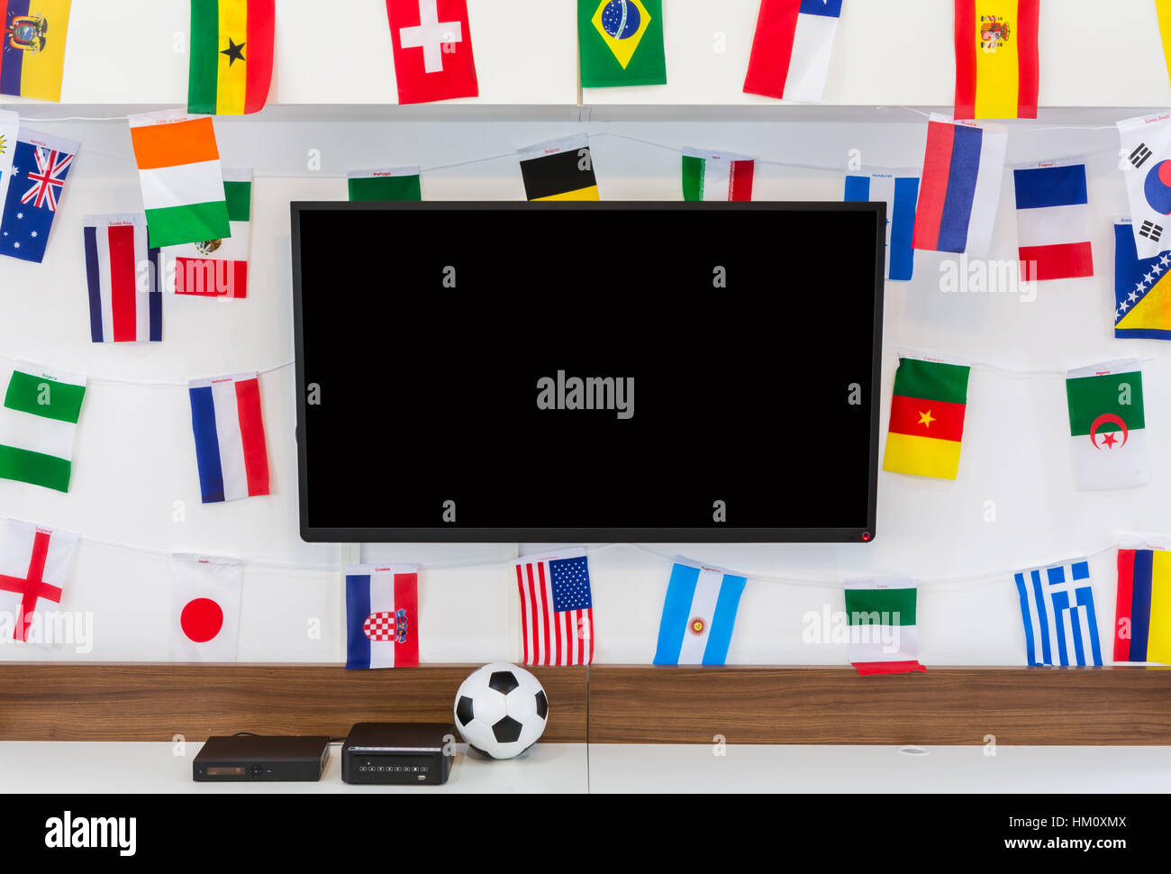 Modern room with TV and Flags for soccer championship 2014 Stock Photo