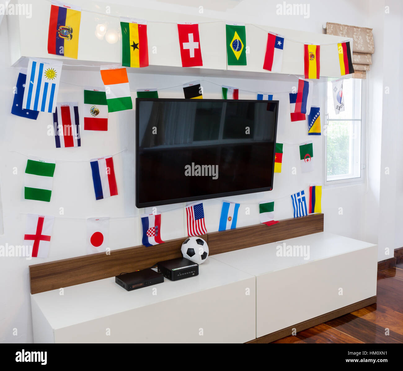 Modern room with TV and Flags for soccer championship 2014 Stock Photo