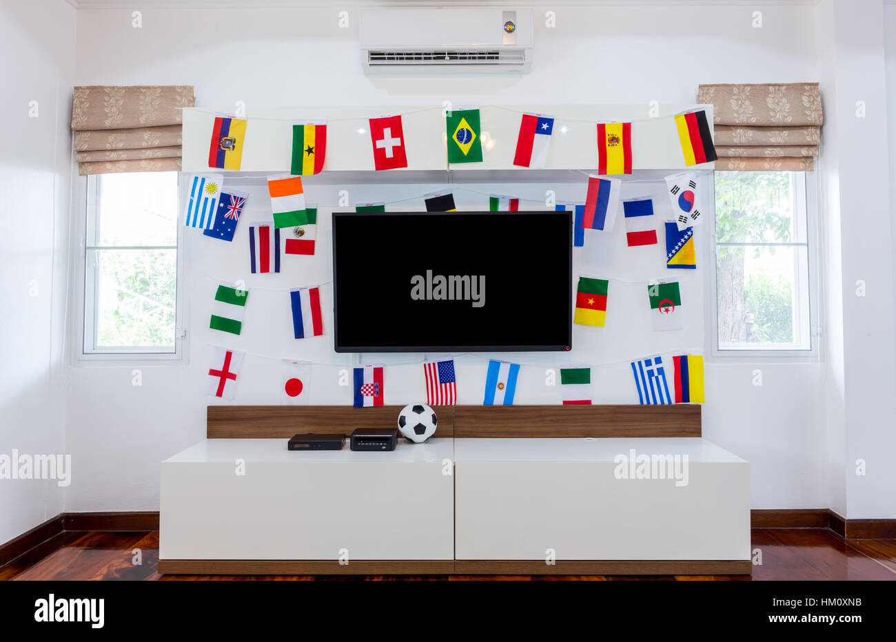 Modern room with TV and Flags for soccer championship 2014 Stock Photo