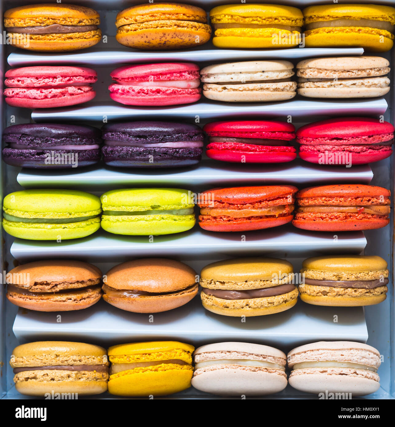 French colorful macarons in a rows Stock Photo - Alamy