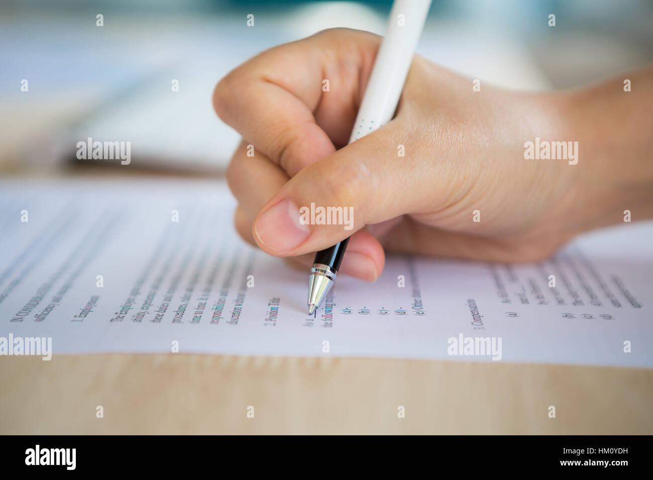 Close up of hand completing an employment application form Stock Photo ...