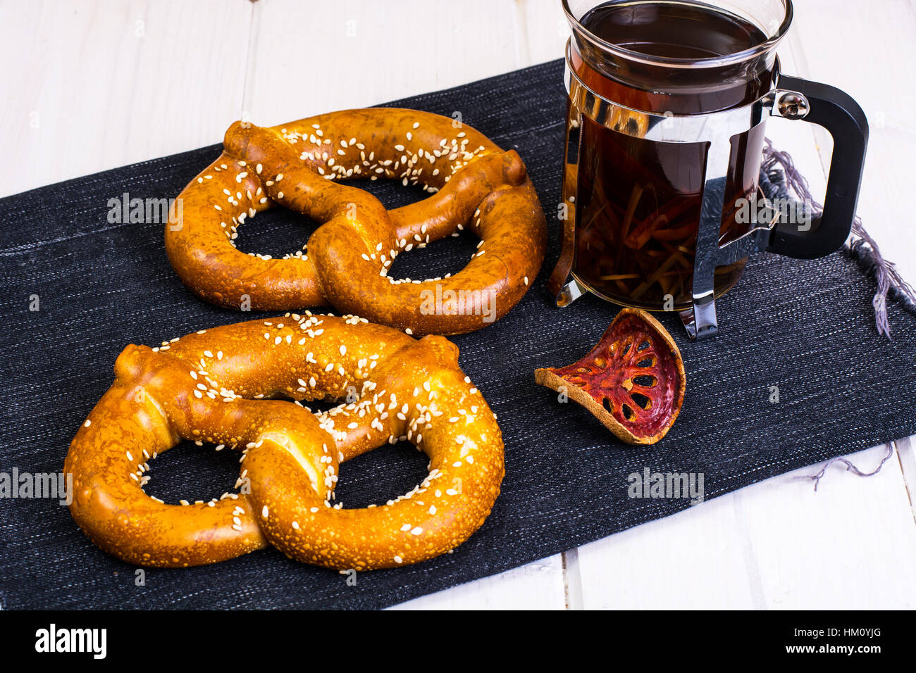 Bavarian pretzels with sesame seeds on white boards Stock Photo Alamy