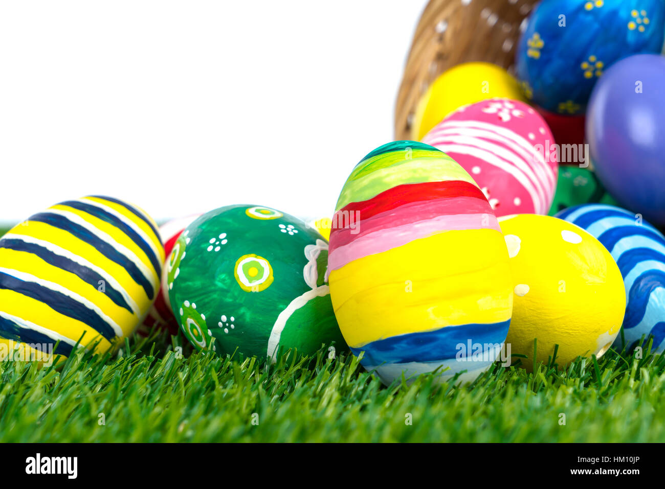 Easter Eggs on Fresh Green Grass over white background Stock Photo - Alamy